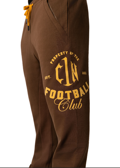 Bless the Babies "Property of Football" Stacked Sweatpants — "The BTB Chocolate Gold" | 2026 C1N Collection