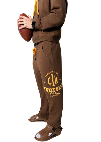 Bless the Babies "Property of Football" Stacked Sweatpants — "The BTB Chocolate Gold" | 2026 C1N Collection
