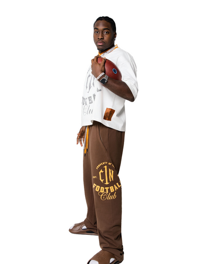 Bless the Babies "Property of Football" Stacked Sweatpants — "The BTB Chocolate Gold" | 2026 C1N Collection