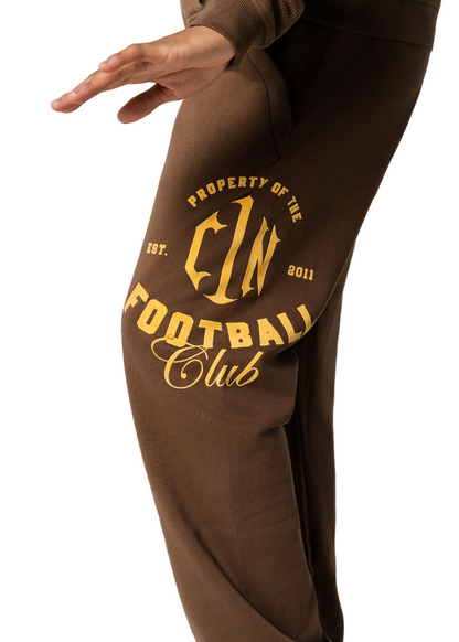 Bless the Babies "Property of Football" Stacked Sweatpants — "The BTB Chocolate Gold" | 2026 C1N Collection